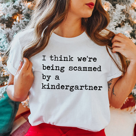 I Think We're Being Scammed By A Kindergartner Unisex Tee